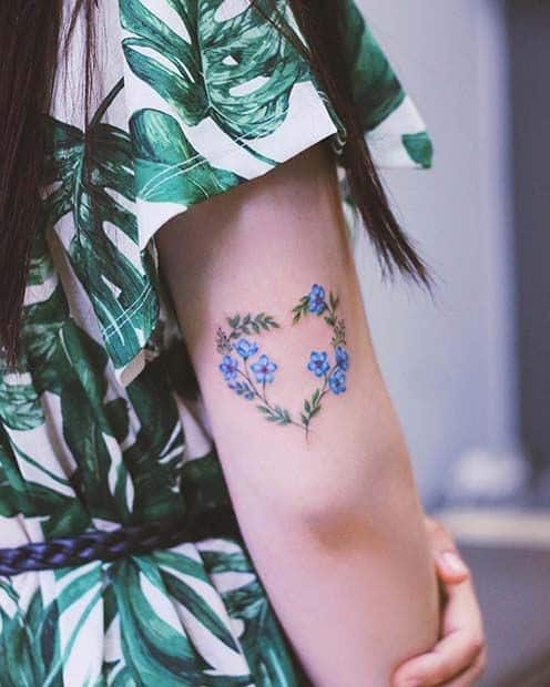 2. Floral Heart Tattoo With Blue Ink