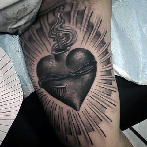 5. Black Ink Arm Tattoo Heart Design With Detailed Lines
