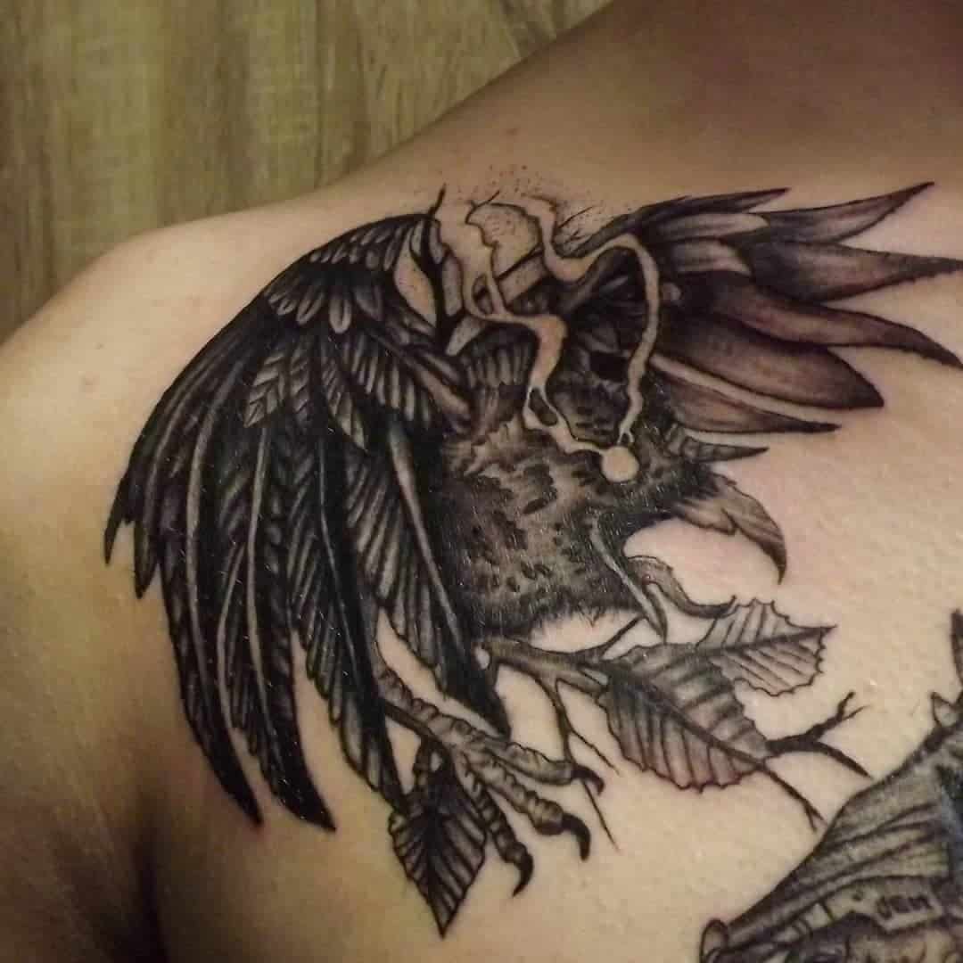 Unique Raven Tattoo With Leaf Details 