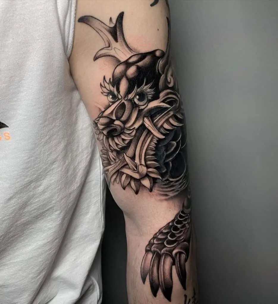 Black Ink Dragon Chinese Tattoo Over Arm