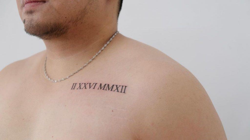 Important Date Over Chest Small Tattoo 