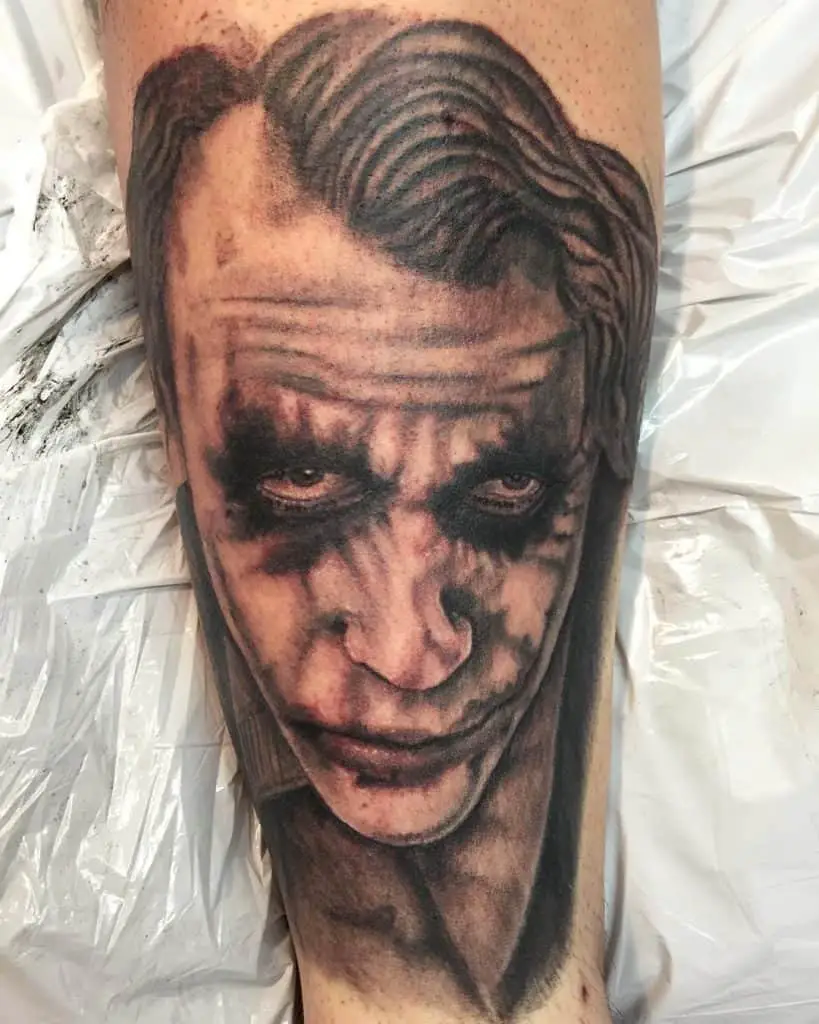 Man Head tattoo on Leg