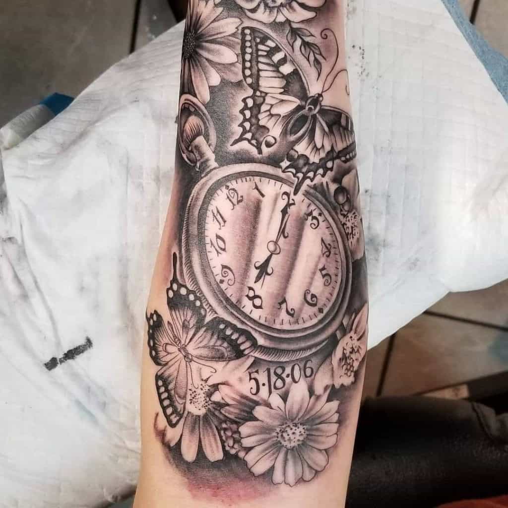 Butterfly, flower and clock tattoo