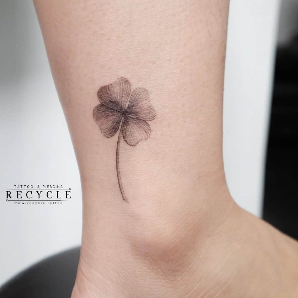 Small Black Flower Ankle Tattoo