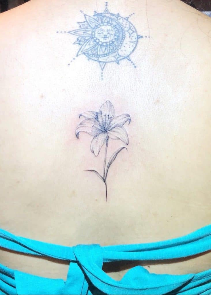 Back Small & Black Lily Tattoo 