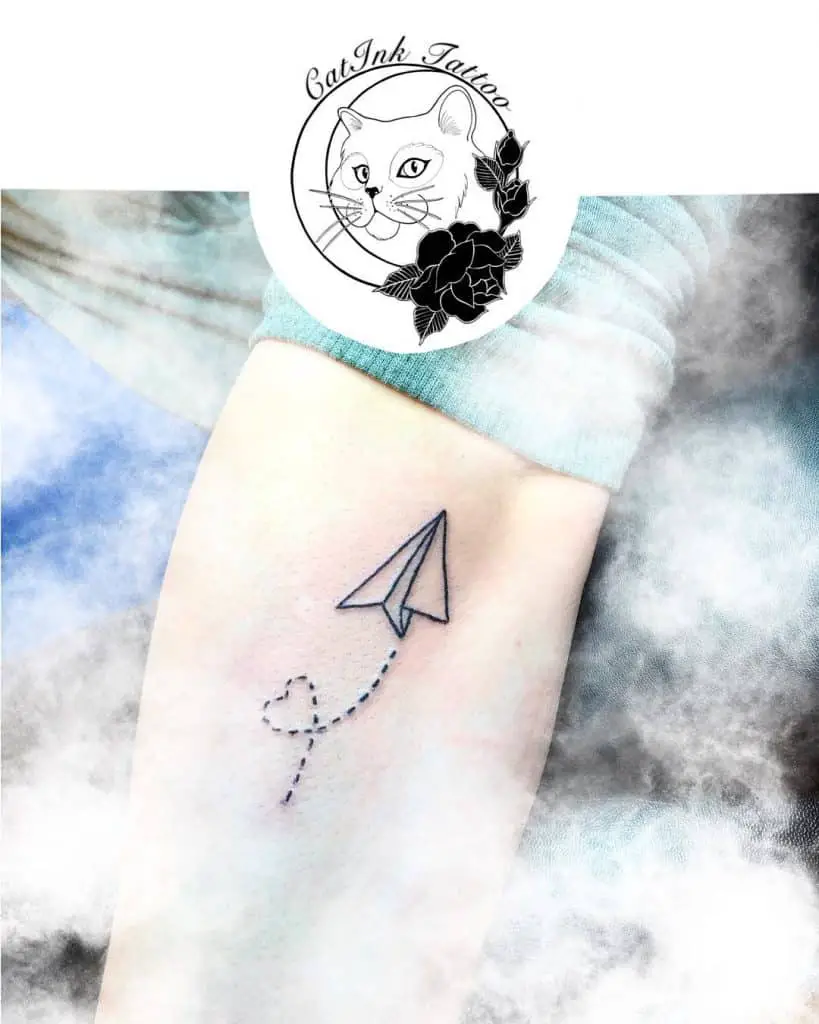 Paper airplane tattoo with big meanings 1