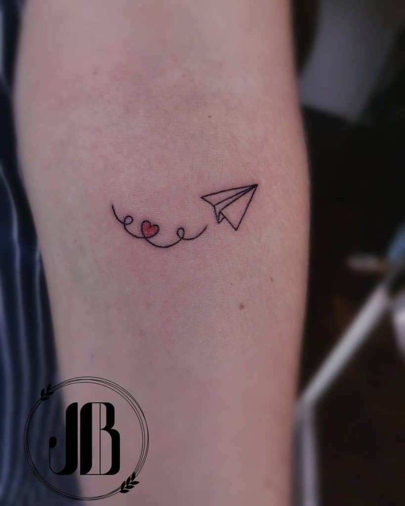 Paper airplane tattoo with big meanings 3