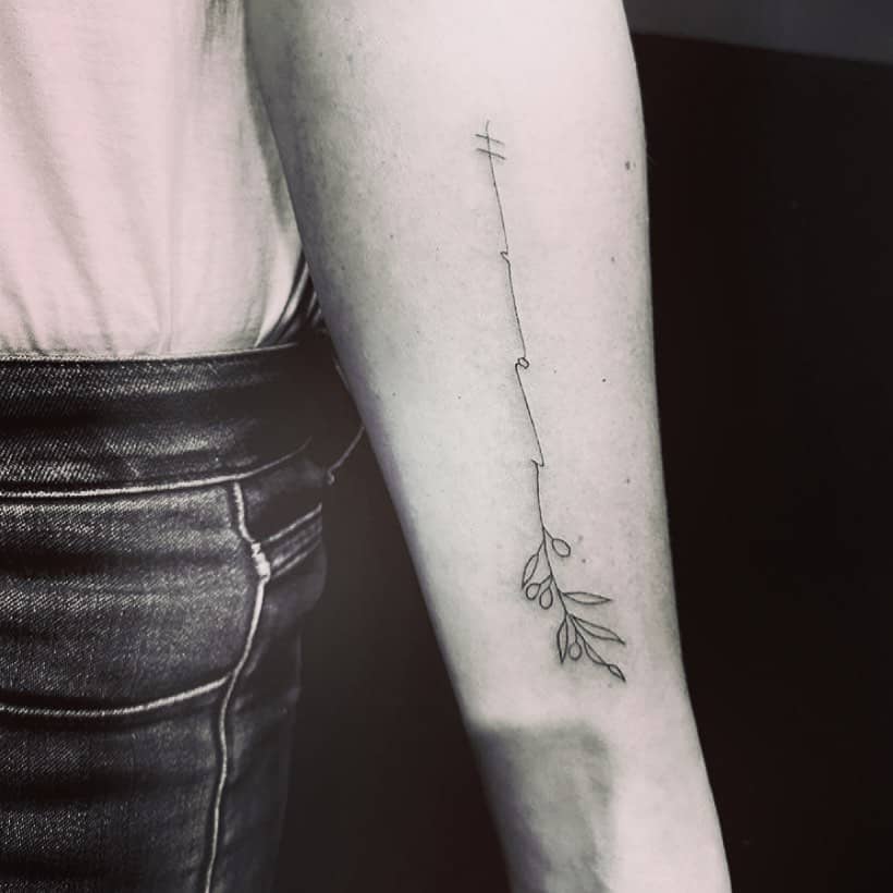 The inner arm minimalist olive branch tattoo