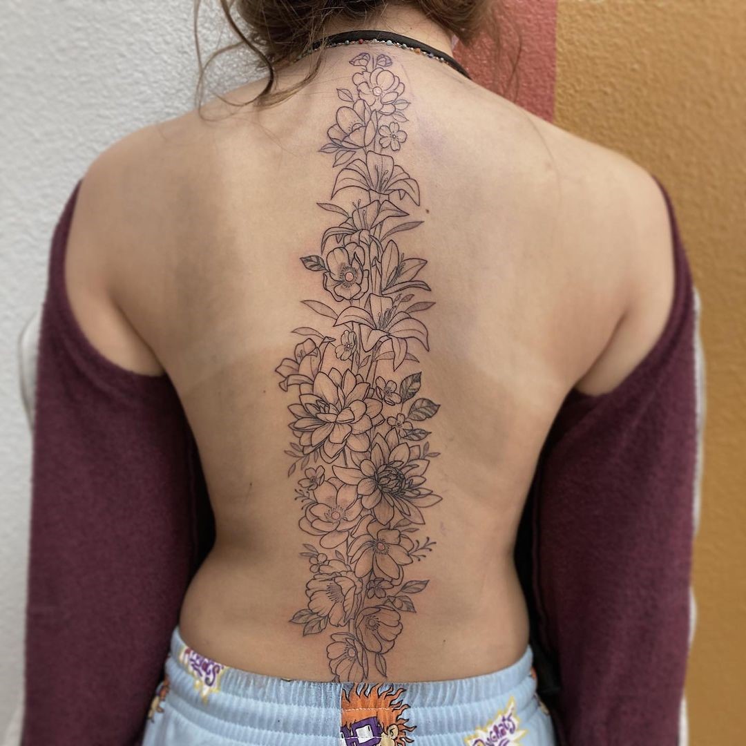 Dramatic, Long & Bold Flower Spine Tattoo 