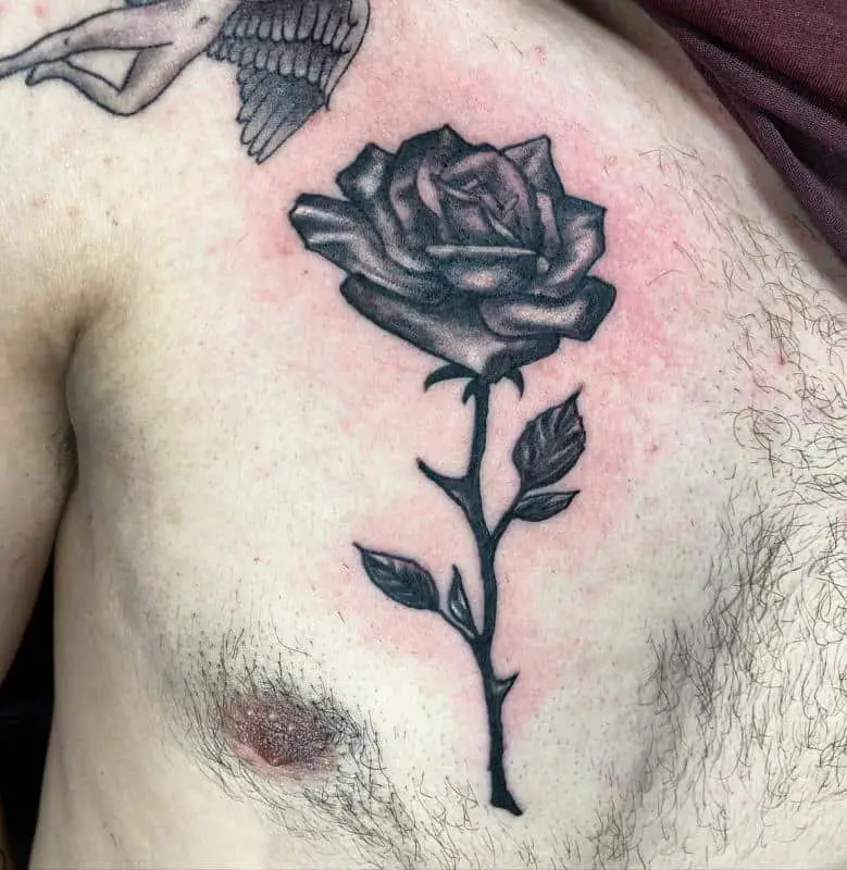 Rose chest tattoo 4