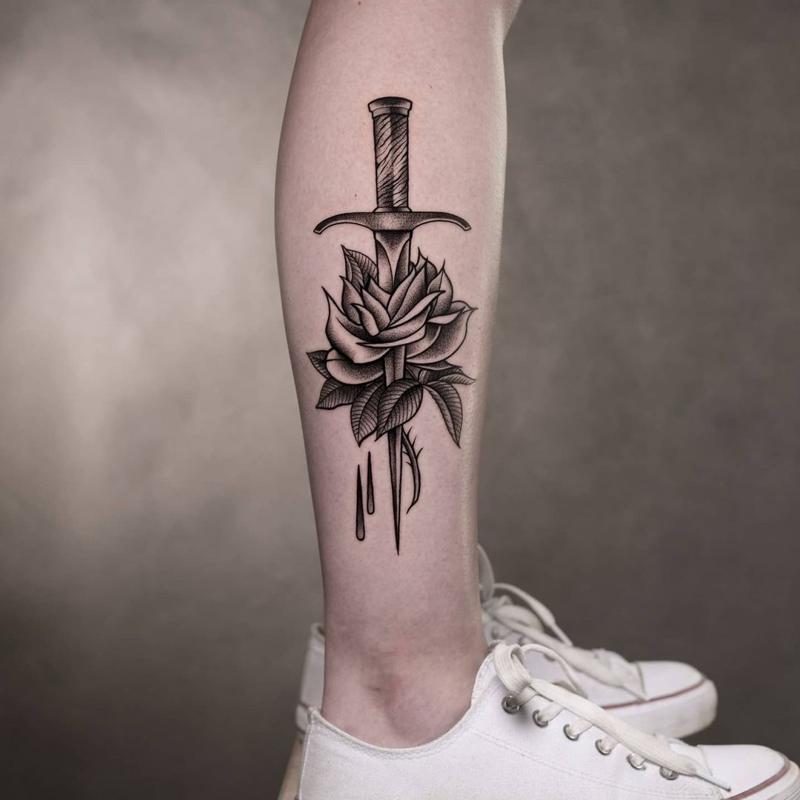 Pierced Dagger And Rose Tattoo 3