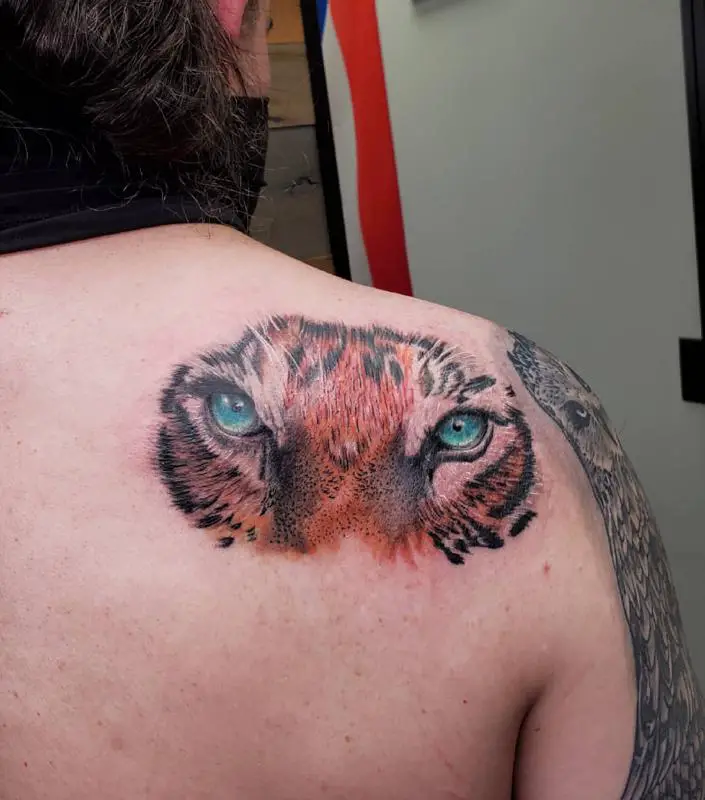 Tiger Eyes On The Back Tattoo Design