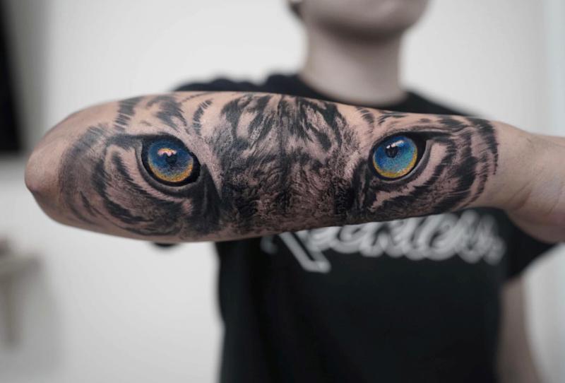 Yellow And Blue Tiger Eyes Tattoo Design